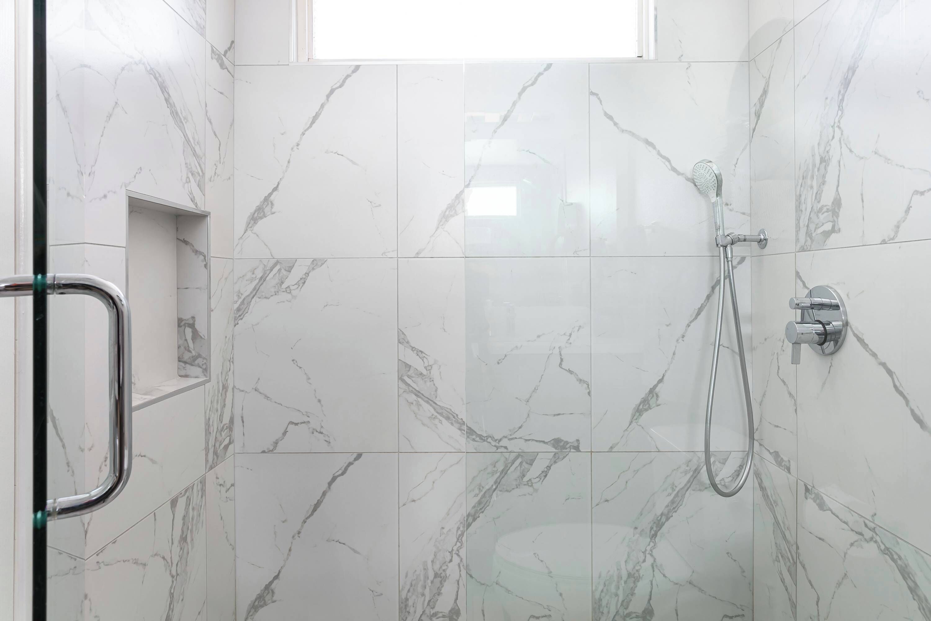 Shower, hair dryer, towels, shampoo