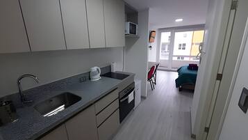 Apartment | Private kitchen | Mini-fridge, microwave, oven, cookware/dishes/utensils