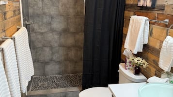 Shower, hair dryer, towels, soap