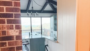 A staircase leading to a balcony with a view of the outdoors. - Archer's Perch -Incredible view - Right along the Blue Ridge Parkway (Hillsville)