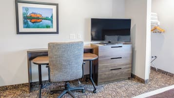 Desk, laptop workspace, blackout drapes, iron/ironing board