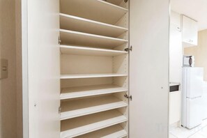 A kitchen with a white refrigerator and a microwave on the countertop. - Fujiterrace Yoga (Tokyo)