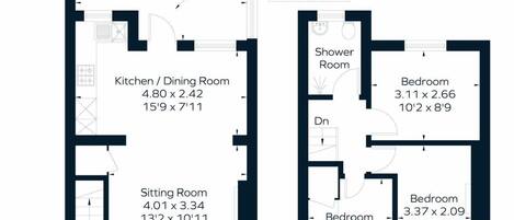 Plan d’étage d’une chambre d’hôtel comprenant un salon, une cuisine/salle à manger, deux chambres, une salle de douche et un hall d’entrée/vestiaire situé à l’arrière.