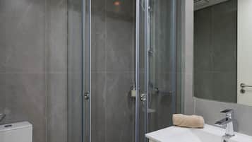 Shower, rainfall showerhead, hair dryer, towels