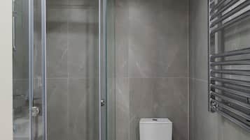 Shower, rainfall showerhead, hair dryer, towels