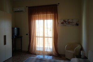 Premium bedding, down comforters, blackout drapes, iron/ironing board
