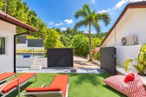 A poolside area with lounge chairs, a small pool, and a covered seating area. - Chalong Hideaway Pool Villa (Phuket)
