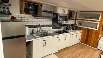 Fridge, microwave, stovetop, coffee/tea maker