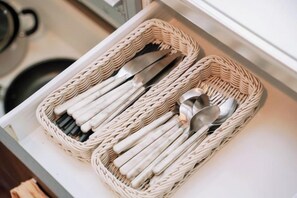 A drawer containing two wicker baskets with utensils. - Nipponbashi Royal (Osaka)