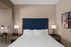 Hypo-allergenic bedding, desk, laptop workspace, blackout curtains