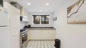 Fridge, microwave, toaster, cookware/dishes/utensils