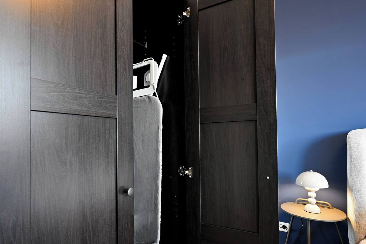 Desk, laptop workspace, blackout curtains, iron/ironing board