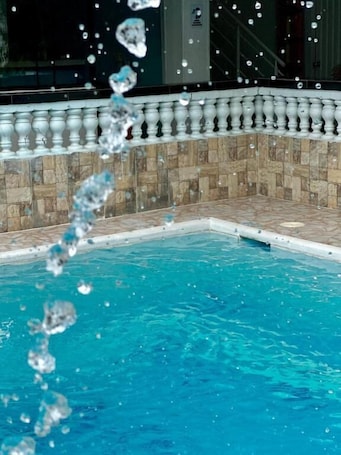 Outdoor pool. HOTEL AVENIDA 15
