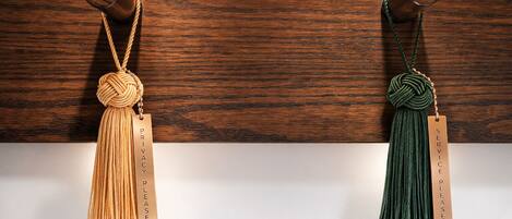 Two wooden wall-mounted items with tassels and tags labeled "PRIVACY PLEASE".