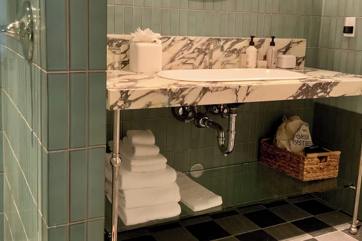 Hair dryer, slippers, towels, soap