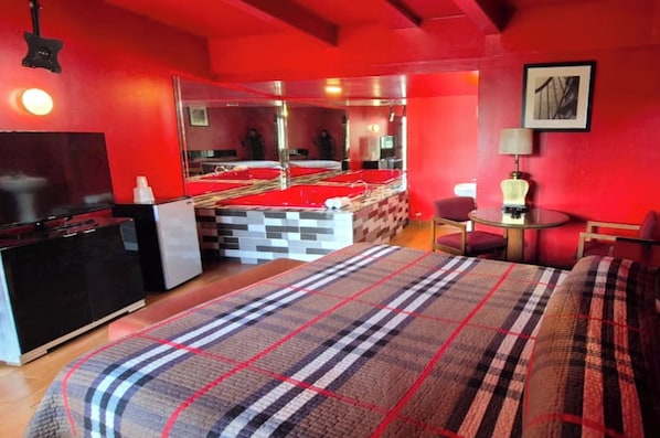 Room, 1 King Bed, Smoking (Jetted Tub) | Desk, iron/ironing board, free WiFi, bed sheets