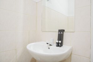 Standard Apartment | Bathroom - Comfort And Cozy Living Studio At Park View Condominium Apartment (Depok)