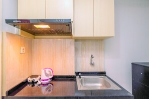 Standard Apartment | Private kitchen | Cookware/dishes/utensils - Simple And Cozy Living Studio At Dramaga Tower Apartment (Dramaga)