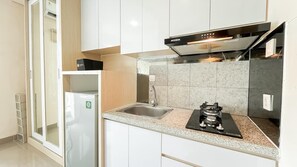 Standard Apartment | Private kitchen | Cookware/dishes/utensils - Soft Neutral Studio At B Residence Apartment (Pagedangan)