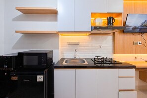Apartamento standard | Cozinha privada | Talheres/pratos/utensílios de cozinha