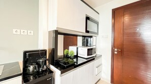 Apartment | Private kitchen | Microwave, stovetop, cookware/dishes/utensils