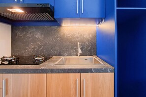 Apartment | Private kitchen | Fridge, stovetop, cookware/dishes/utensils - Pop Color Touch 2Br At Urbantown Serpong Apartment (South Tangerang)