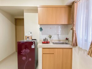 Apartment | Private kitchen | Fridge, stovetop, cookware/dishes/utensils