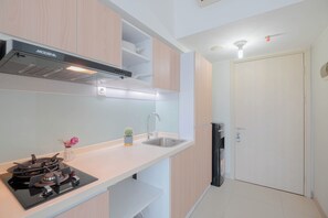 Apartment | Private kitchen | Fridge, stovetop, cookware/dishes/utensils