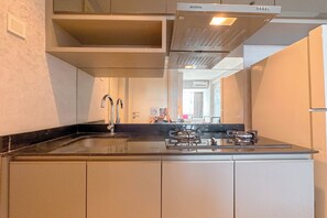 Apartment | Private kitchen | Fridge, stovetop, cookware/dishes/utensils