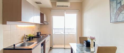 Apartment | Private kitchen | Fridge, stovetop, cookware/dishes/utensils