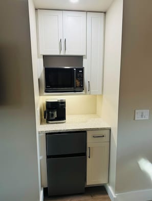 Fridge, microwave, coffee/tea maker, toaster