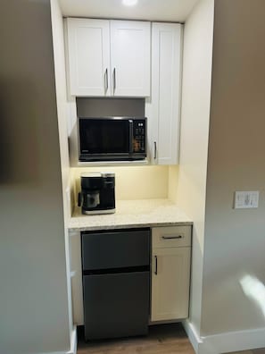 Fridge, microwave, coffee/tea maker, toaster