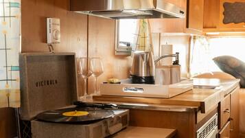 Fridge, microwave, coffee/tea maker, cookware/dishes/utensils