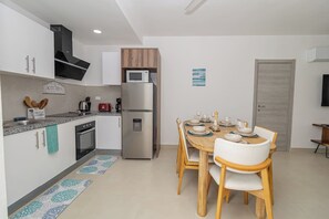 Fridge, microwave, oven, stovetop - Modern 2BR/2BA Condo w Pool 10 min walk to Beach (San Rafael del Yuma)