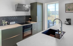 Fridge, stovetop, dishwasher, coffee/tea maker