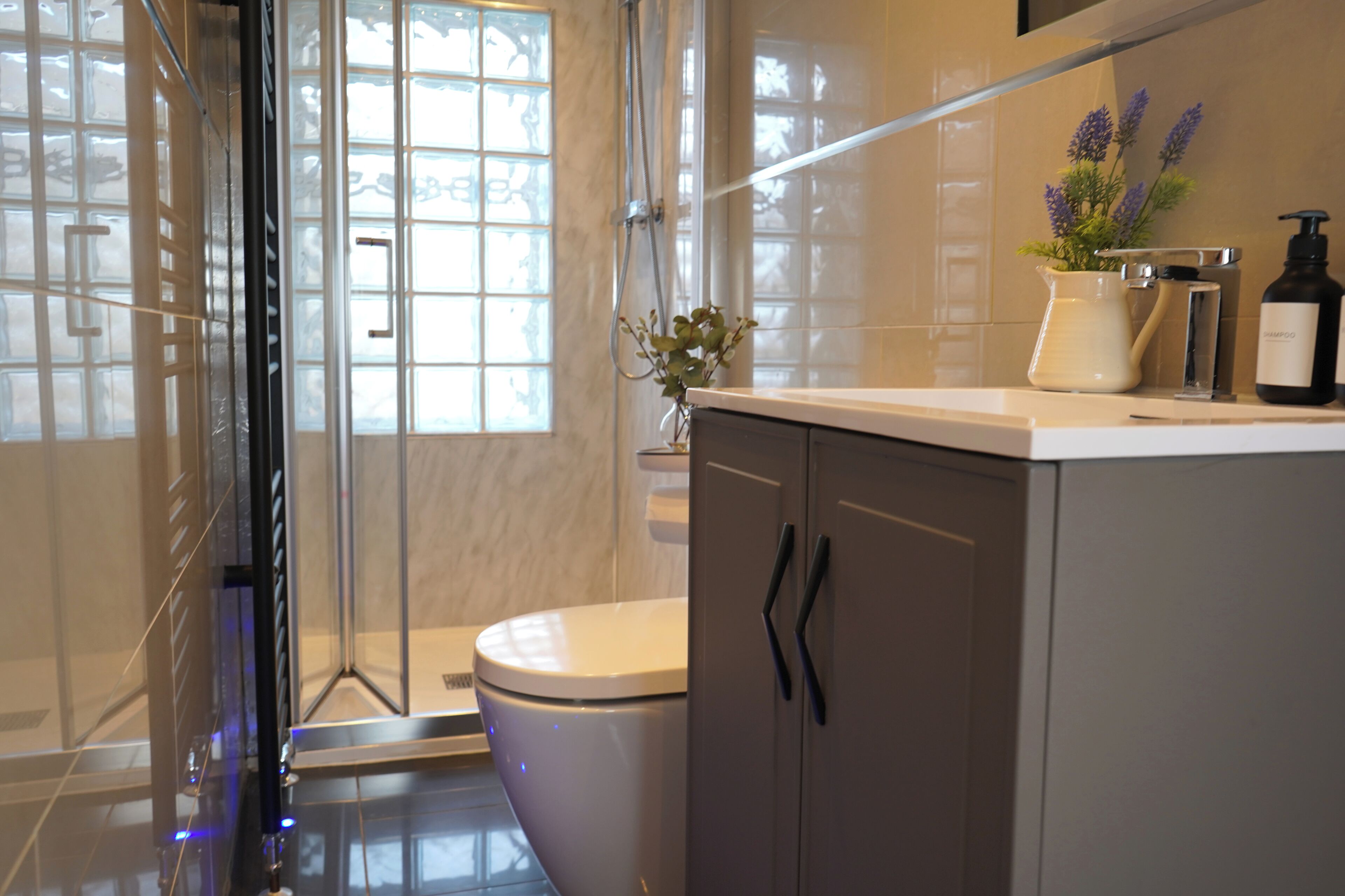 Shower, hair dryer, towels, soap