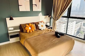 A modern bedroom with a large bed, city view, and artwork on the wall. - Continew Residence by Xuan and Partner (Kuala Lumpur)