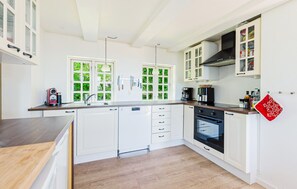 Fridge, stovetop, dishwasher, coffee/tea maker