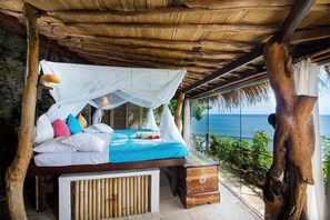 Habitación doble Deluxe, vista al océano | Wifi gratis y ropa de cama