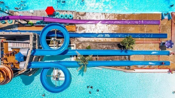 A water park with multiple slides and a pool area. - Ellis Sands with LSV, Arcade, and Billiards (Miramar Beach)