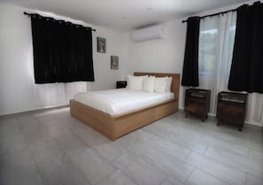 Deluxe Apartment, 2 Queen Beds, Pool View | Blackout drapes, iron/ironing board, free WiFi