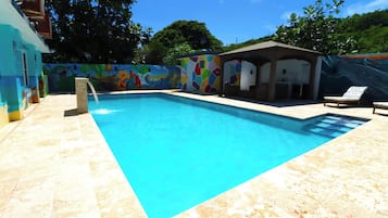 Outdoor pool, open 7:00 AM to 8:00 PM, pool umbrellas, pool loungers