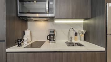 Fridge, microwave, stovetop, coffee/tea maker