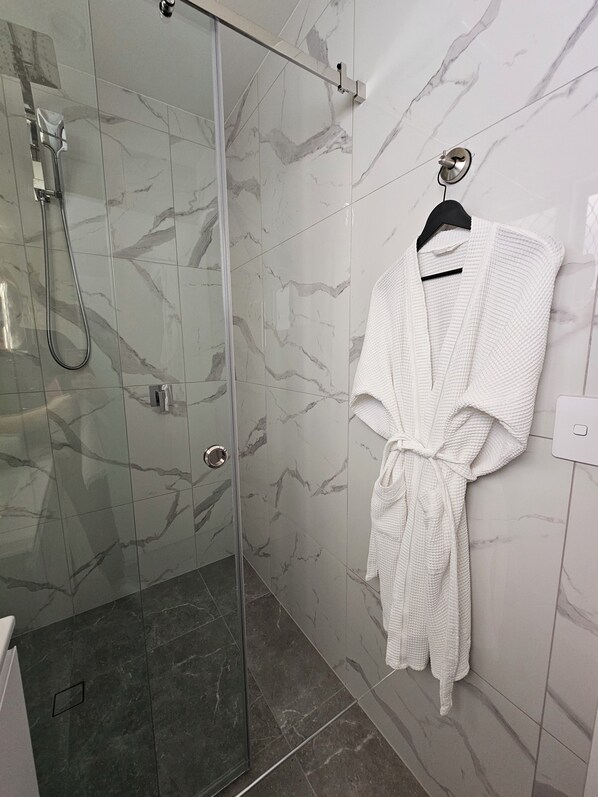 Shower, hair dryer, towels, soap