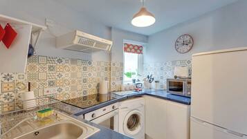 Fridge, microwave, oven, cookware/dishes/utensils