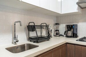 Fridge, microwave, stovetop, coffee/tea maker