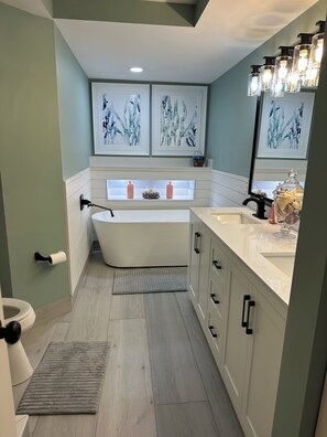 Shower, hair dryer, towels, toilet paper