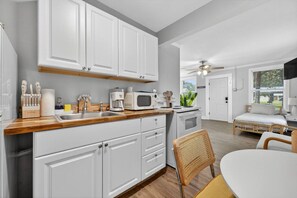 Fridge, microwave, stovetop, coffee/tea maker