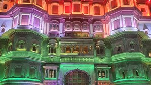 A historic building with ornate architecture and a large central archway. - Narmada Guest House (Indore)