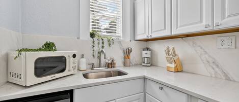 Fridge, microwave, stovetop, coffee/tea maker